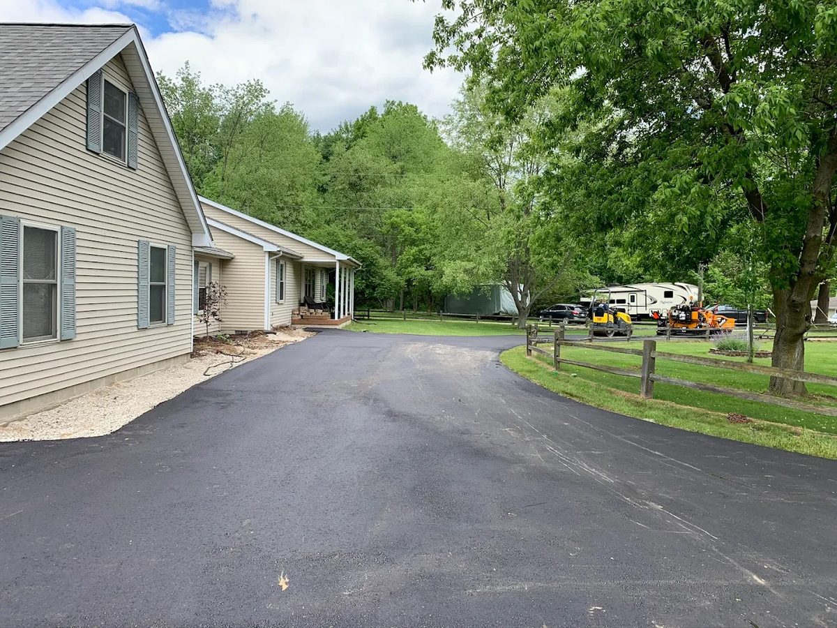 Completed asphalt driveway at a Southeast Michigan home