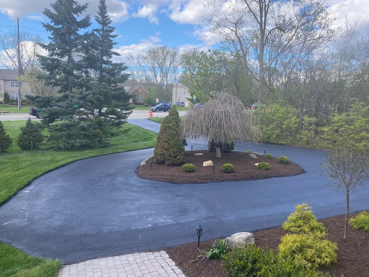 Freshly paved residential asphalt driveway